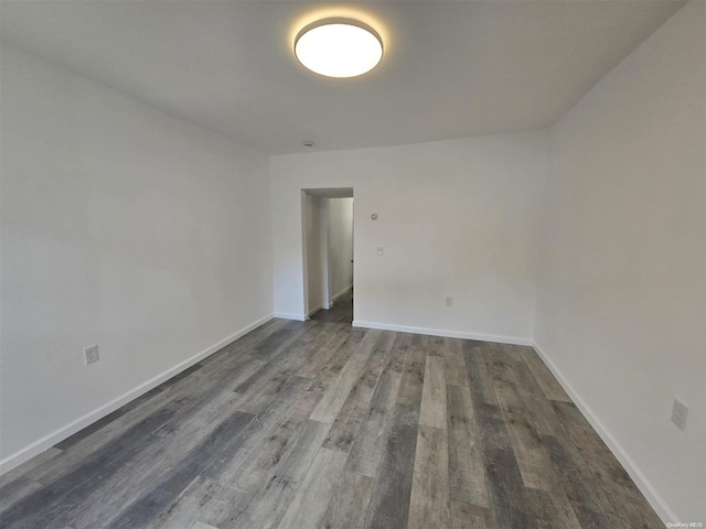 empty room featuring dark hardwood / wood-style floors