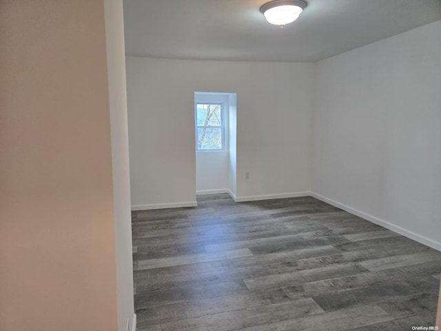 empty room featuring dark hardwood / wood-style floors