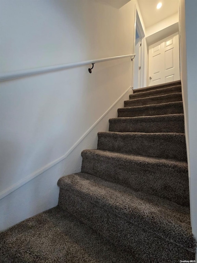 stairs with carpet flooring