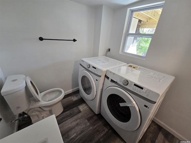 laundry room featuring separate washer and dryer and dark wood-type flooring