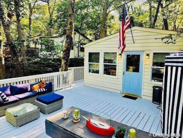 wooden deck with outdoor lounge area