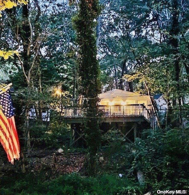 rear view of property with a deck