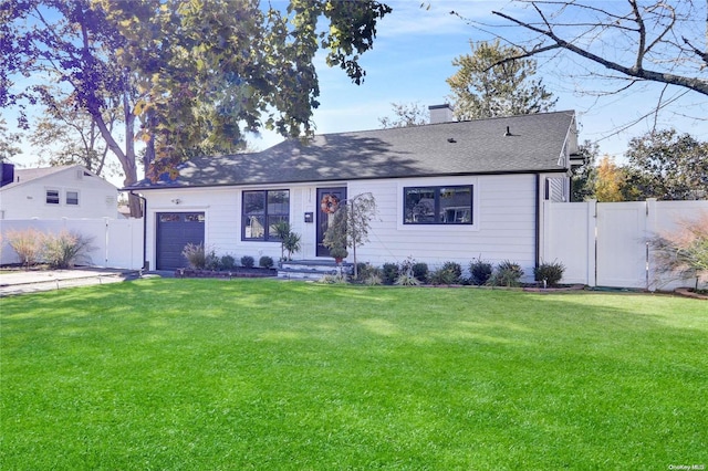 ranch-style house with a front yard and a garage