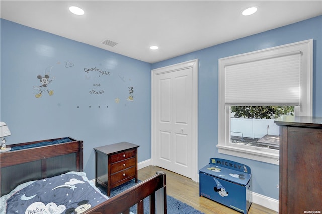 bedroom featuring a closet and light hardwood / wood-style flooring