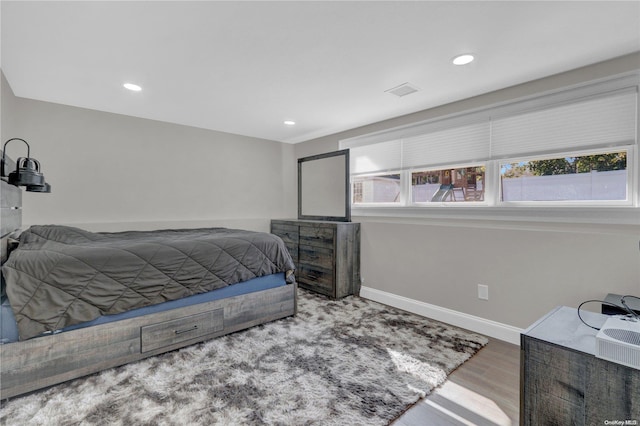 bedroom featuring hardwood / wood-style floors