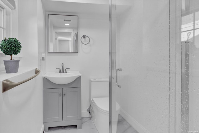 bathroom with toilet, an enclosed shower, and vanity