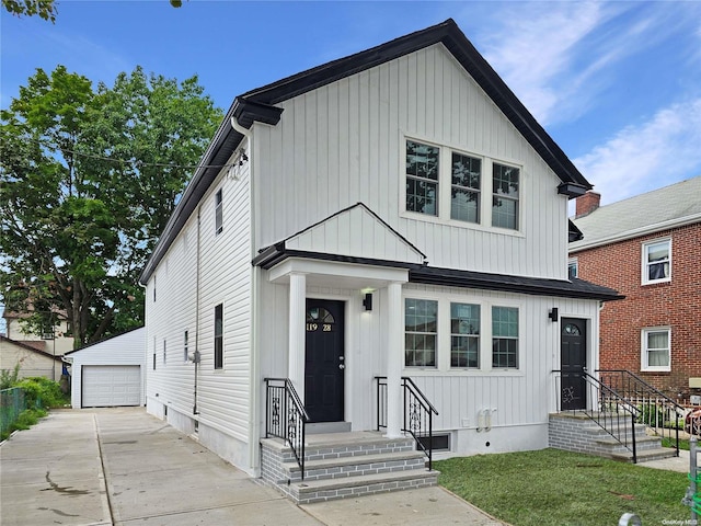 view of front of home with an outbuilding and a garage