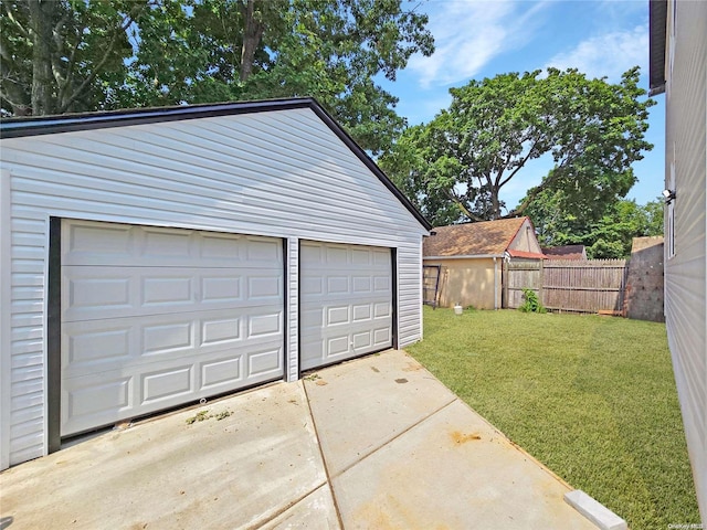 garage with a lawn