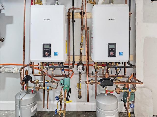 utility room featuring water heater