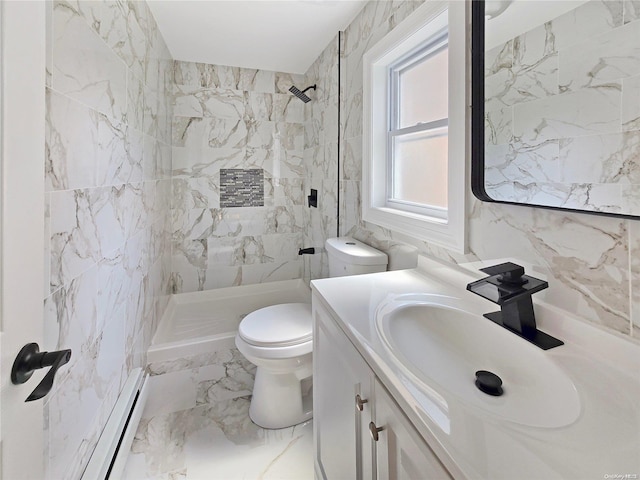 bathroom with vanity, toilet, baseboard heating, tiled shower, and tile walls