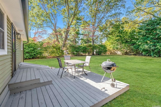 wooden terrace with a yard