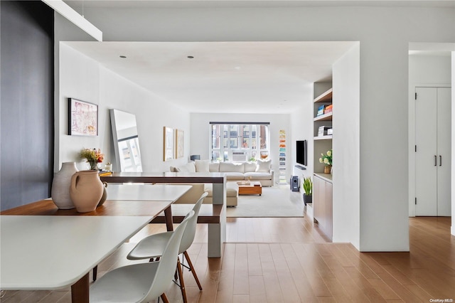 dining space featuring light wood-type flooring