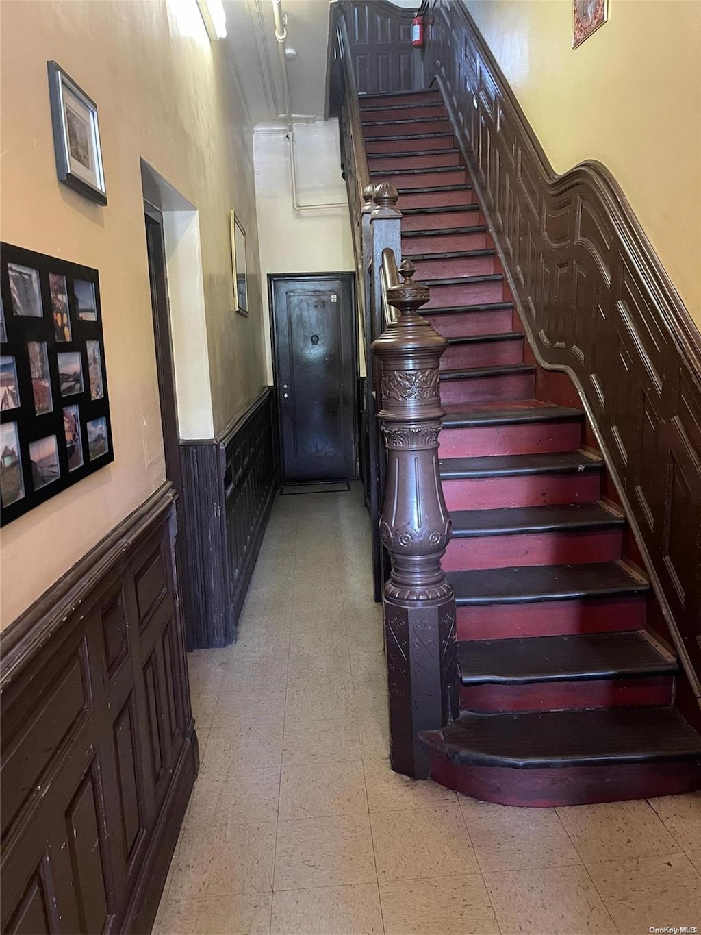 stairway featuring a high ceiling