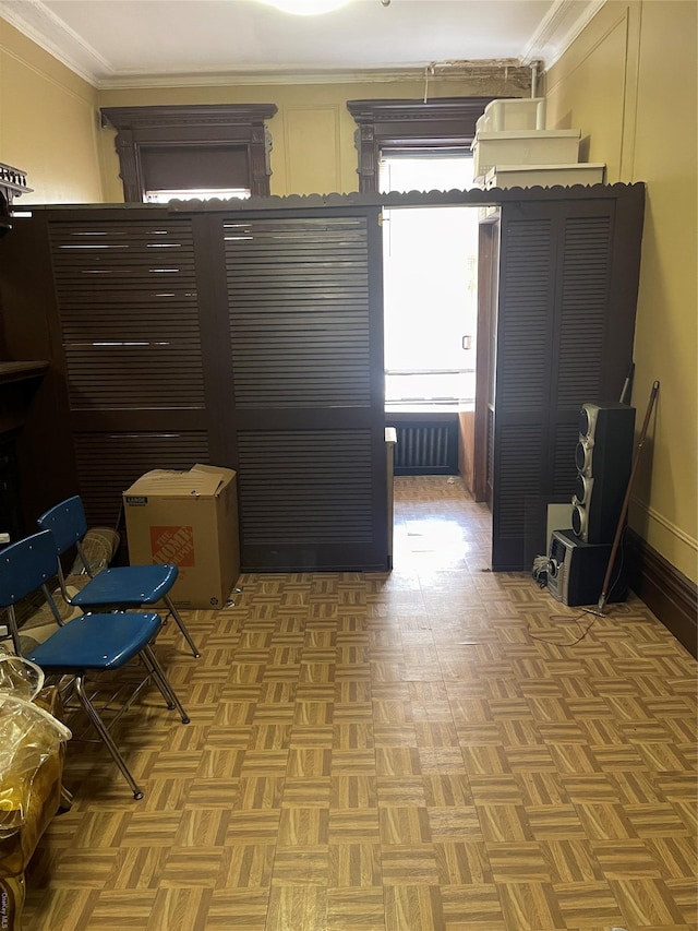 corridor with crown molding and parquet floors