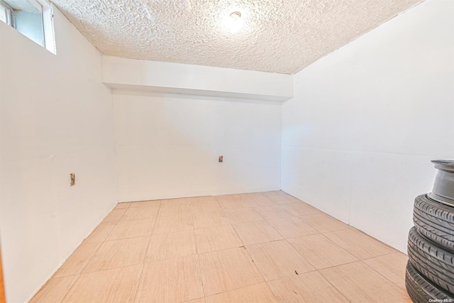 basement with a textured ceiling