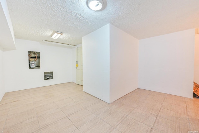 spare room featuring a textured ceiling