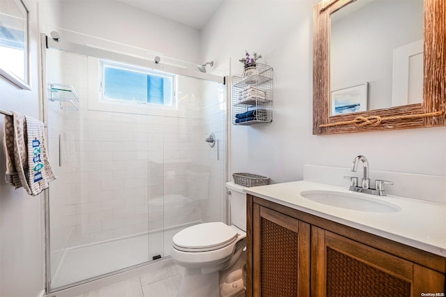 bathroom featuring tile patterned flooring, vanity, toilet, and an enclosed shower