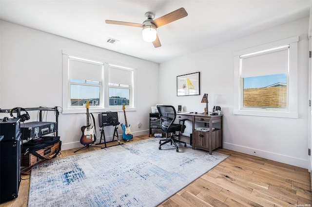 office area with ceiling fan and light wood-type flooring