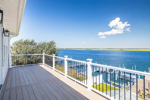 wooden deck with a water view