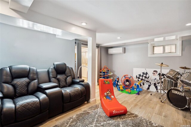 92-52 219th St, Queens Village, NY 11428 - rec room with a wall mounted air conditioner, wood finished floors, and recessed lighting