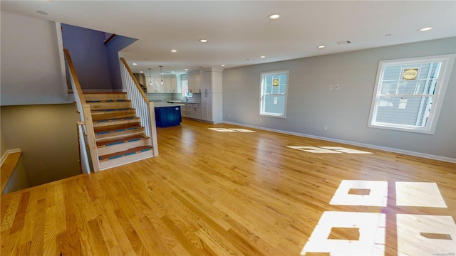 unfurnished living room featuring light hardwood / wood-style floors