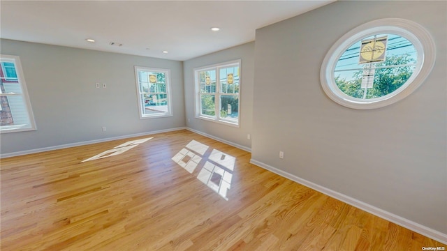 empty room with light hardwood / wood-style floors