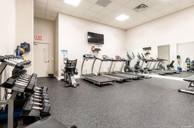 workout area featuring a paneled ceiling