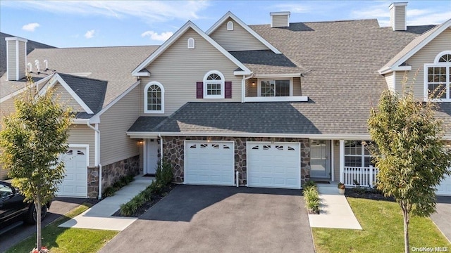 35 Steven Cir Unit 35, Dix Hills, NY 11746 - traditional-style house with asphalt driveway, stone siding, a shingled roof, and a garage