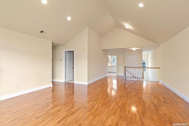 35 Steven Cir Unit 35, Dix Hills, NY 11746 - spare room featuring high vaulted ceiling, light wood-style floors, and recessed lighting