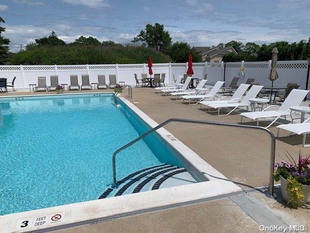 35 Steven Cir Unit 35, Dix Hills, NY 11746 - community pool featuring a patio