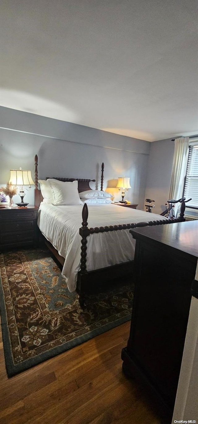 bedroom featuring dark wood-type flooring