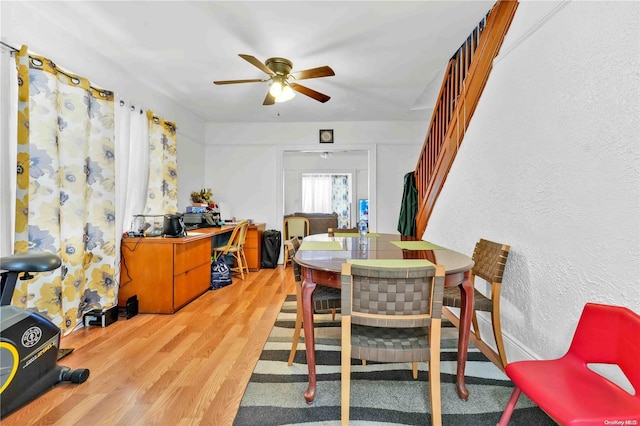 dining room with hardwood / wood-style floors and ceiling fan