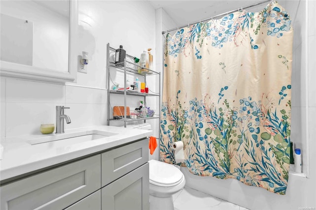 full bathroom featuring vanity, shower / bath combination with curtain, tile walls, and toilet