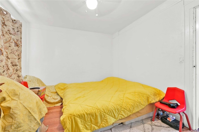 bedroom featuring ceiling fan and crown molding