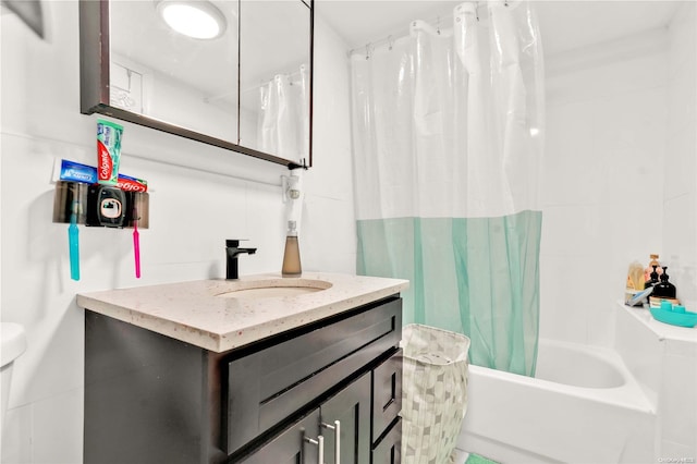 bathroom with vanity, tile walls, and shower / tub combo with curtain