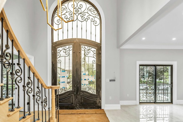 259-09 81st Ave, Glen Oaks, NY 11004 - foyer entrance featuring a towering ceiling, french doors, recessed lighting, and stairs