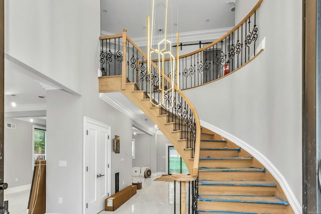 259-09 81st Ave, Glen Oaks, NY 11004 - stairway with a towering ceiling and crown molding