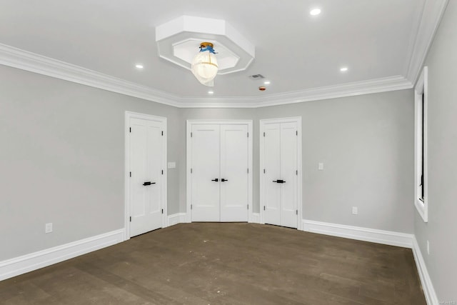 259-09 81st Ave, Glen Oaks, NY 11004 - unfurnished bedroom featuring two closets, crown molding, wood finished floors, and recessed lighting