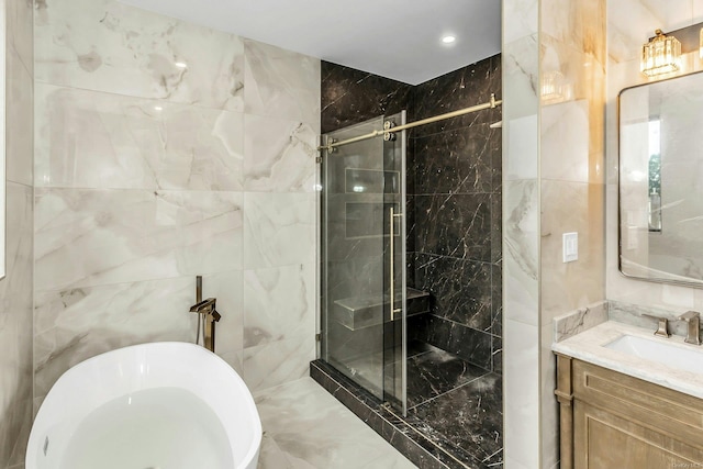 259-09 81st Ave, Glen Oaks, NY 11004 - bathroom featuring a soaking tub, a marble finish shower, vanity, and tile walls
