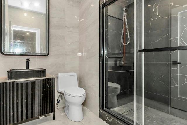 259-09 81st Ave, Glen Oaks, NY 11004 - bathroom with a shower stall, vanity, and tile walls