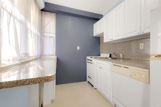 kitchen featuring white appliances, tasteful backsplash, white cabinetry, and sink