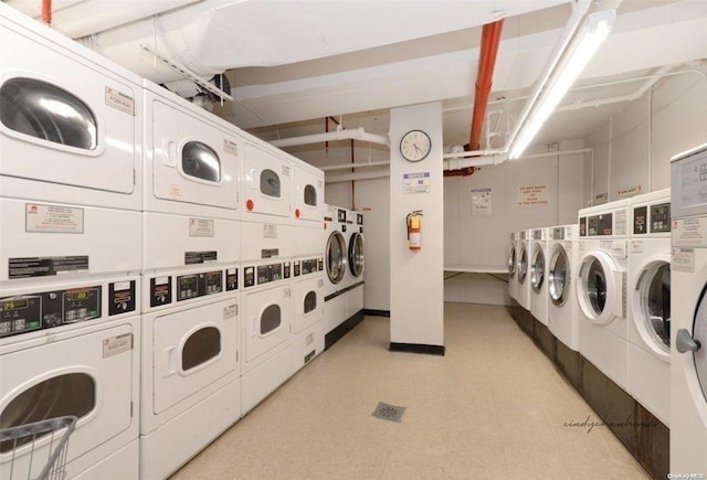 laundry room with separate washer and dryer and stacked washer and clothes dryer