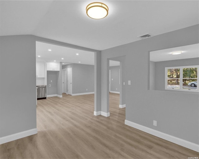 unfurnished living room with light wood-type flooring