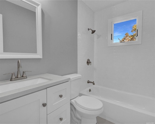 full bathroom with vanity, toilet, and tiled shower / bath combo