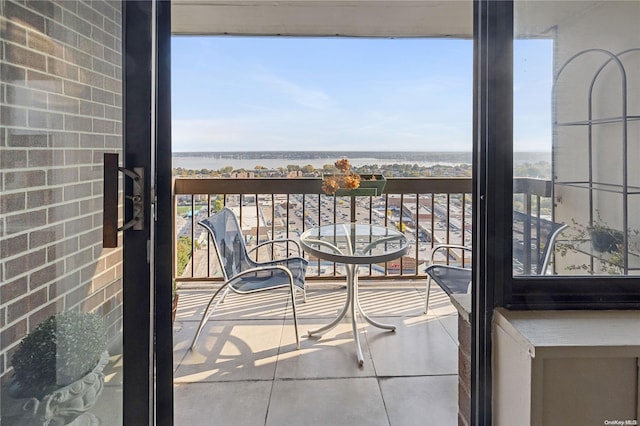 balcony featuring a water view