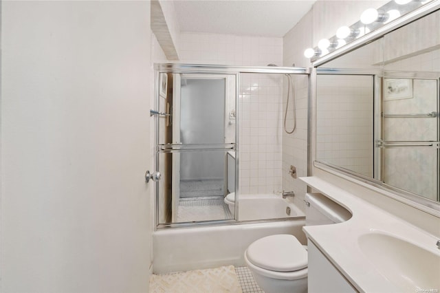 full bathroom with vanity, enclosed tub / shower combo, a textured ceiling, and toilet