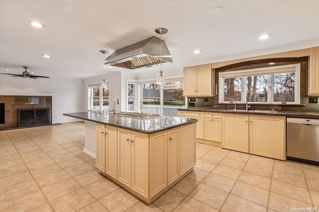 kitchen with pendant lighting, sink, island exhaust hood, a kitchen island with sink, and stainless steel appliances