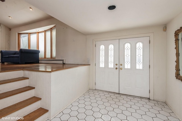 entryway featuring vaulted ceiling