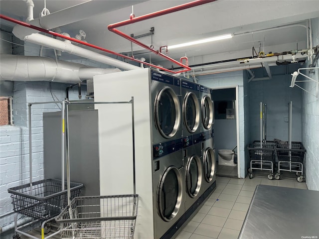 laundry area with stacked washer / dryer and washing machine and clothes dryer