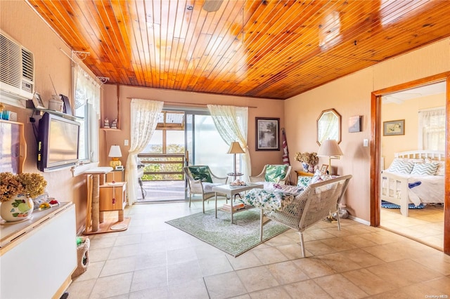 living area with light tile patterned floors, an AC wall unit, and wooden ceiling